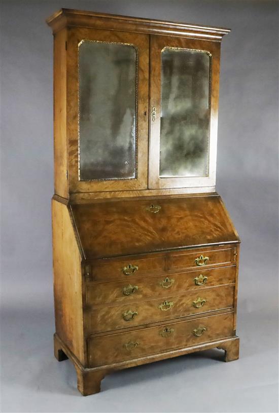 An early 18th century walnut bureau bookcase, W.3ft 6in. D.1ft 10in. H.6ft 10in.